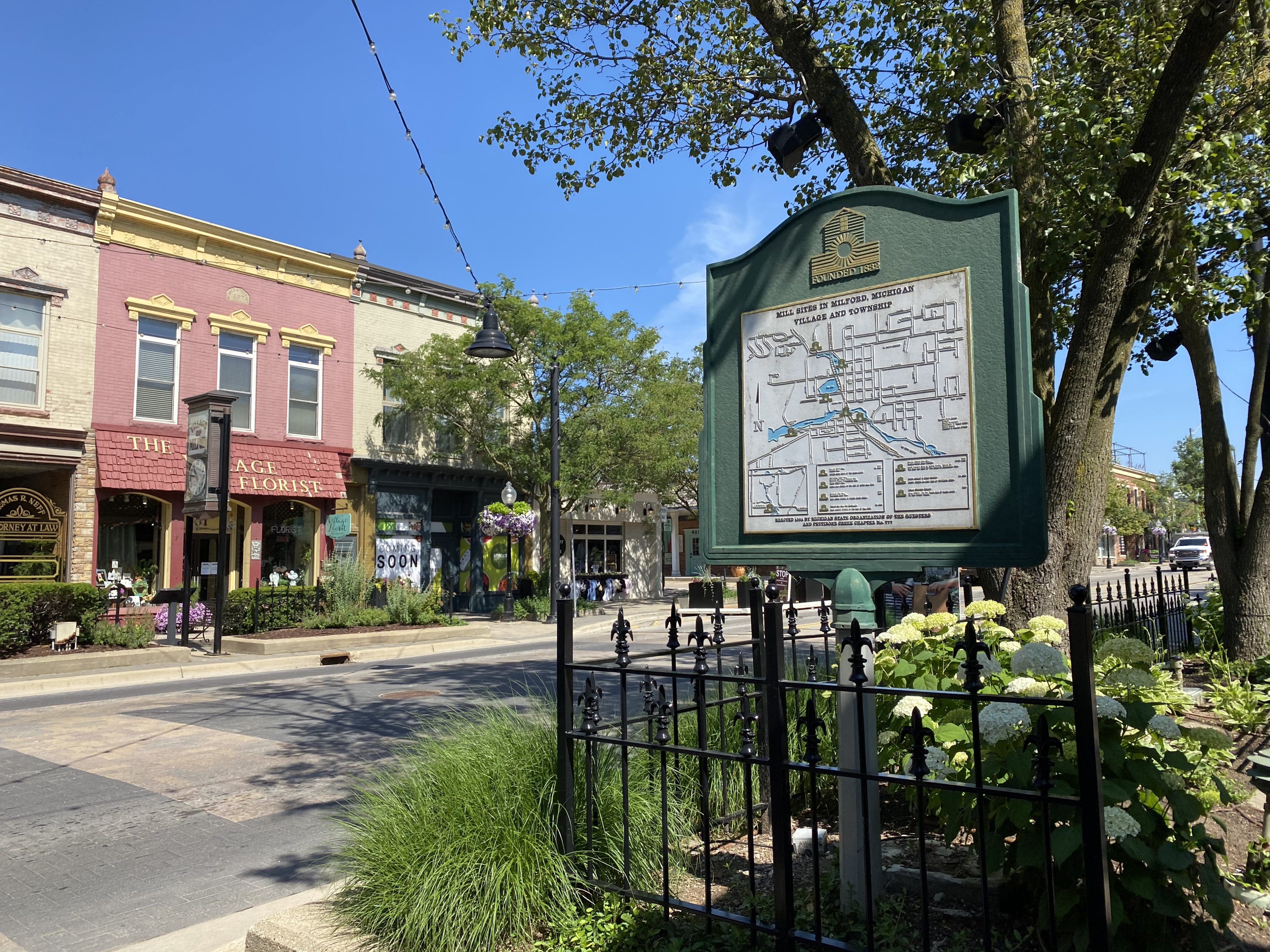 Historic downtown street with map sign and colorful buildings