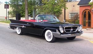 Vintage black convertible car on street