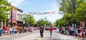 Crowds gathered for Memorial Day parade in town street.
