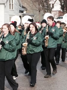 High school marching band in parade.