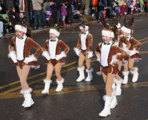 Children in reindeer costumes at parade