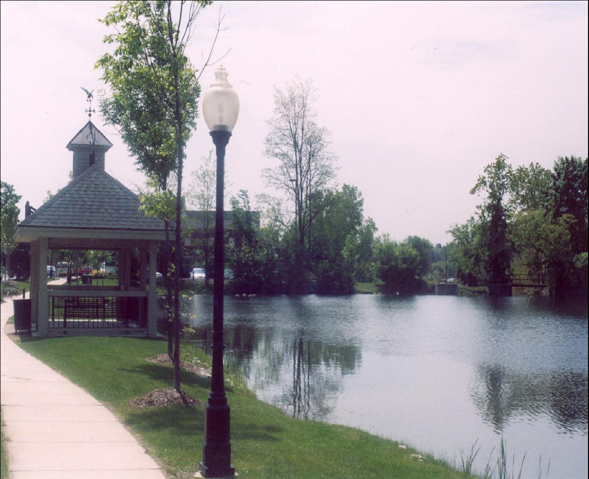 Scenic park gazebo by a tranquil lakeside