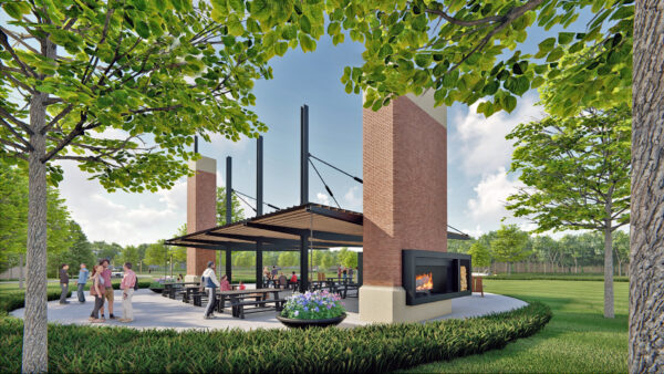 Outdoor park pavilion with people and fireplace.