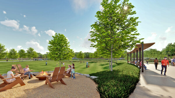 Sunny park with people, trees, and outdoor seating.