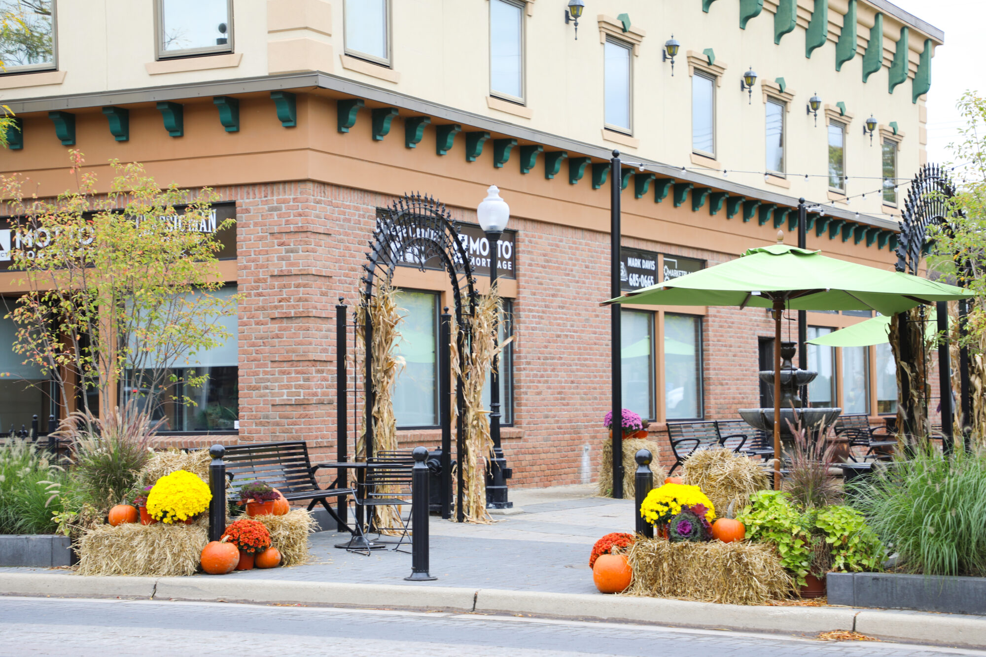 Autumn decorations outside a brick building with café